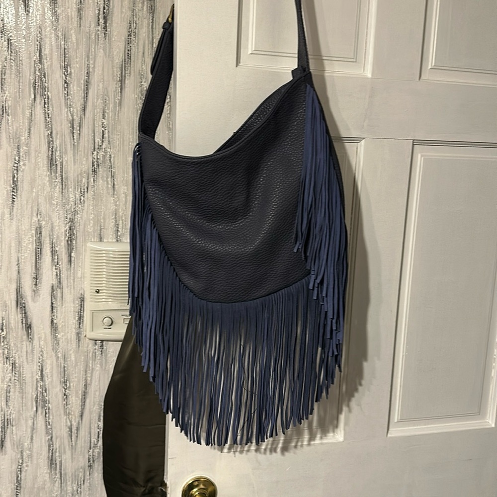 Slate blue shoulder bag with fringes and adjustable strap with buckle